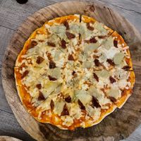 Tomas pizza $280 for the larger size  at La Matatena Pizzeria in Oaxaca