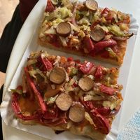 Pizza slice split in two at Alice in Wonder Pie in Santiago De Compostela