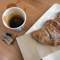 Vegan empty croissant and espresso (I spilled it myself) at Natoo in Padua