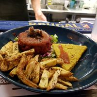 Beetroot burger with polenta and fries  at Marta's Veggie Fusion in Split