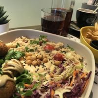 Falafel bowl, fries, and passion fruit iced tea  at Marta's Veggie Fusion in Split