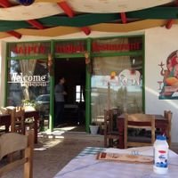 Entrance with outdoor seatings at Jaipur Palace in Santorini