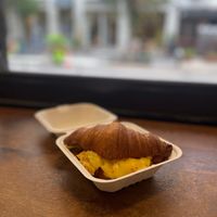 The Miles: just egg, bacon, provolone, chives and mayo on a croissant at Orchard Grocer in New York City