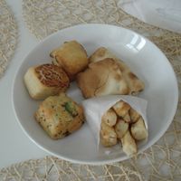 "French fries", "mushroom ravioli", "egg roll", and 3 types of pogacsa at Fill Good in Budapest