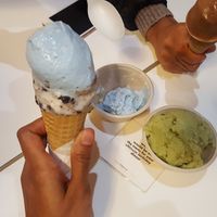 All of these are vegan. The blue is birthday cake, the green is matcha, the brown is chocolate, the cone also has cookies and cream at BRICS in Indianapolis