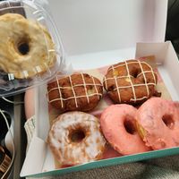 2 apple fritters, 1 glazed, 2 strawberry sprinkled, and one caramel at Five Daughters Bakery - Eastland Ave in Nashville