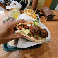 falafel sandwich, golden milkshake, lemon tuneric seltzer at Goldie - Sansom St in Philadelphia
