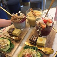 brunch with chia pudding/açaí bowl + golden milk  at Oslo Raw - Adamstuen Torg in Oslo