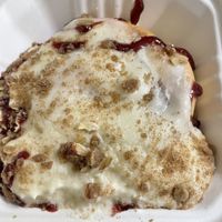 Vanilla frosting, raspberry jam, pie crumble  at Cinnaholic in Meridian