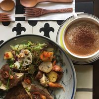 Brunch platter, latte at The Organik Kitchen Saigon in Ho Chi Minh City