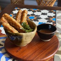Tempeh sticks with lime leaves and BBQ sauce  at The Organik Kitchen Saigon in Ho Chi Minh City