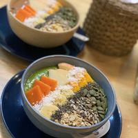Green smoothie (front) and chocolate smoothie bowl (back) at Khun Kae's Juice Bar in Chiang Mai