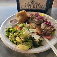 Falafel bowl with side of samosa at Medi's Mediterranean Fusion Restaurant in Macon