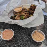 Fried Brussel Sprouts (be sure to ask for vegan sauces )  at Zombie Burger in Des Moines