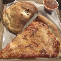Vegan cheese calzone and slice at Pazzo Wood Fired Pizza in Wading River