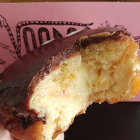 The indistinguishable Vegan Portland Cream. So hard to photograph, but I promise the custard was amazing! And the chocolate icing was also really good! at Voodoo Doughnut in Universal City