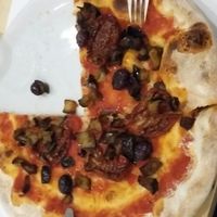 pizza with eggplant, sundried tomatoes and olives  at Olio Doliva in Sofia