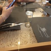 Mesa con pasta 🍝 debajo at Olio Doliva in Sofia