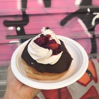 Vegan cream filled donut with chocolate, cream and strawberries  at Chök in Barcelona
