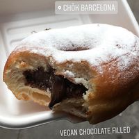 Chok Barcelona - Vegan chocolate filled doughnut topped with icing sugar at Chök in Barcelona