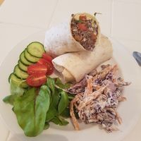 Black bean and avacado wrap with side salad and slaw. Delicious! at Johnny V's in Gosport