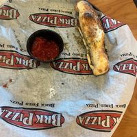 This was the 4 garlic sticks with vegan Parmesan   at BRK Pizza in Naples