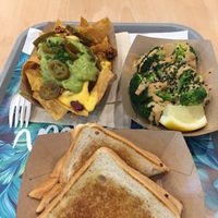 Bocadillos, brocoli peanut sauce, nachos guacamole cheese at Khambú Quart in Valencia