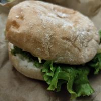 Chicken burger hiding in all that lettuce at Khambú Quart in Valencia