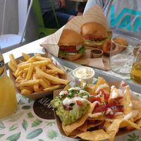 Nachos, fries, veg curry sauce, barbecue sauce, onion rings, nuggets, Hamburguesa Khambú and Hamburguesa Mexicana. Everything was delicious! at Khambú Quart in Valencia