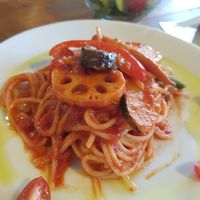 Pasta tomato sauce with salad and rice bread. at Tierra Cafe in Toyama