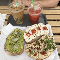 Iced coffee with almond milk, grapefruit juice, avocado, hummus and almond cheese sandwiches   at Lifehouse Bistro in Prague