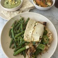Avocado hummus, tofu, kungpow califlower, sichuan beans and snap peas, and roasted sweet potatoes   at Flower Child in Del Mar