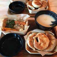 Lunch boxes with stir fried dumplings  at Mo Mo - Saint-Gilles in Brussels