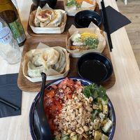 Momo salad, steamed molos, steamed veggies and the lunch menu with stir fried momos, soup and steamed vegetables  at Mo Mo - Saint-Gilles in Brussels