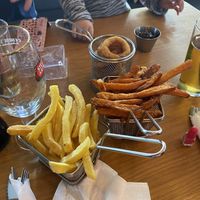 Patatas fritas, boniatos, aritos de cebolla.  at Gourmet Burger Room in Marbella