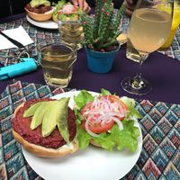 My burger with my tea and kumbucha at Flora in Quito