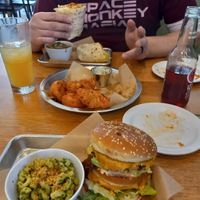 "dirty secret" burger with some pesto mac. Cauliflower wings, and a buffalo chicken wrap. at J Selby's in St Paul