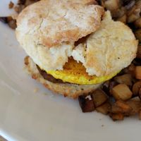 Vegan sausage and egg sandwich with potatoes  at J Selby's in St Paul