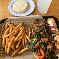 Steak Sandwich with a side of fries. Lemon Olive Oil Tahini Sugar Cookie. Limeade Spritz. at J Selby's in St Paul