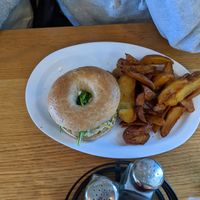 Veggie breakfast bagel with amazing cream "cheese" and breakfast potatoes at J Selby's in St Paul
