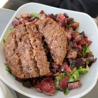 Roasted veggie salad topped with a Beyond Burger at MidMod Cafe in Palm Springs