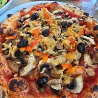 Pizza without cheese - replaced ham with olives at Pizzeria Les 2 Sources in Sainte-enimie