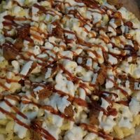 Vegan mac and cheese pizza with bbq sauce and soy sausage at Little Nook Cafe in West Sayville