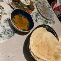 Starters - pita bread, mouhamara (red pepper and pomegranate Dip) and falafel - the white dip was vegan  at Ilili in Tenerife