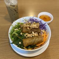 Bún chà giò (vermicelli noodles with spring rolls and veggies— $1.62USD) & iced coffee  at Veggie Saigon - Vietnam & Thai Vegan Restaurant in Ho Chi Minh City