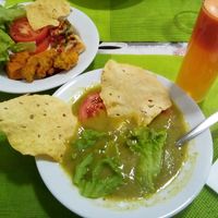 Carrot, lemon and ginger juice; broccoli soup; salad, wheat cake, fried snacks, mini vegan pizzas. at Lisbon Vegan Restaurante in Lisbon
