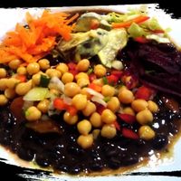 Black beans with carrots, chickpeas, eggplant with potato in creamy sauce and salad at Lisbon Vegan Restaurante in Lisbon
