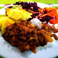 Black chickpeas, assortment of mixed vegetables and salad at Lisbon Vegan Restaurante in Lisbon