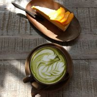 Matcha latte and mango raw cake. at Vibe Cafe in Phnom Penh