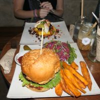 Honest burger with sweet potato fries   at Vibe Cafe in Phnom Penh